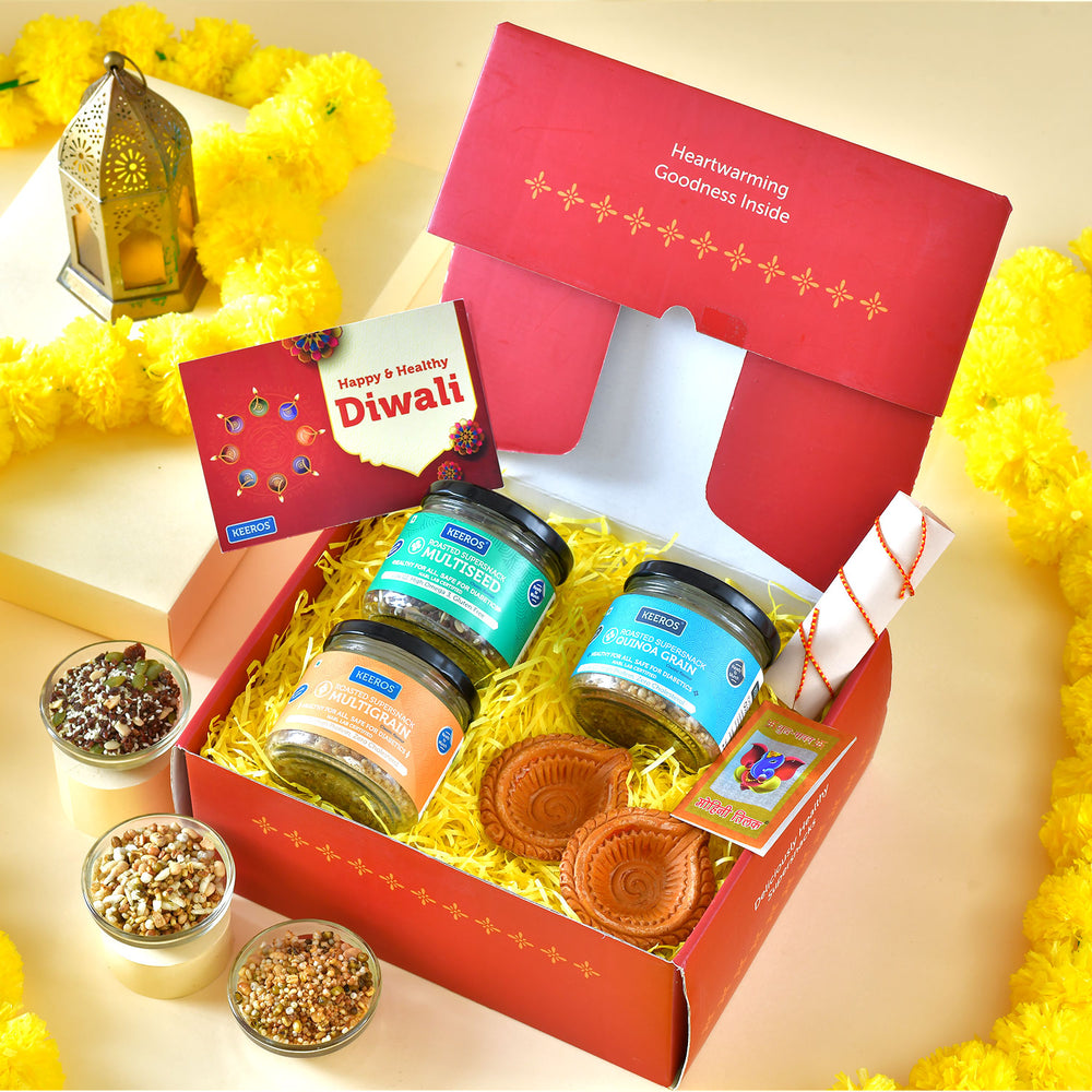 Keeros Healthy Diwali Gift Box with 2 Beautiful Brass Diya & Card : Combo of Sweet & Salted, Tasty & Nutritious Super Snacks in Elegant Glass Jars Packed in Premium Gift Hamper | Diwali  Gift for Family and Friends