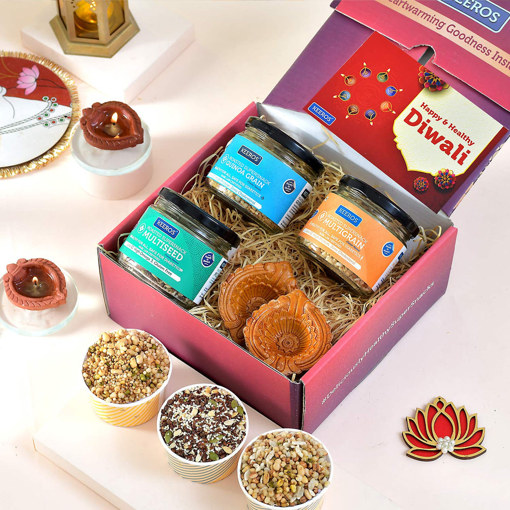 Keeros Healthy Diwali Gift Box with Card : Combo of Sweet & Salted, Tasty & Nutritious Super Snacks in Elegant Glass Jars Packed in Premium Gift Hamper with 2 Beautiful Diyas | Diwali Gift for Family and Friends